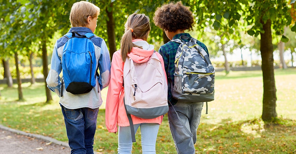 elementary school students walking away from the camera.jpg