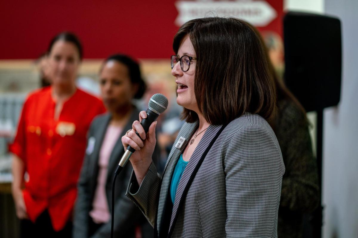 program manager speaking at a corporate partners event for the business school