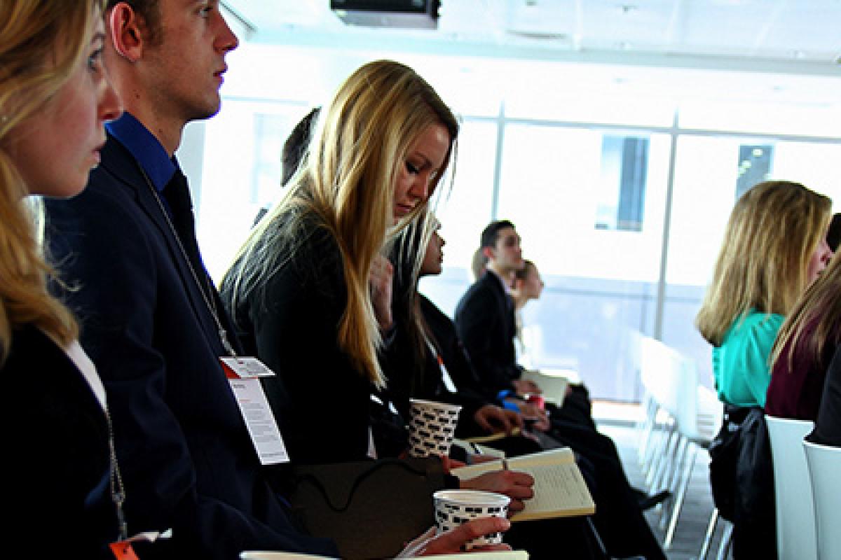 Honors and scholars students from the Leeds School of Business working on a project