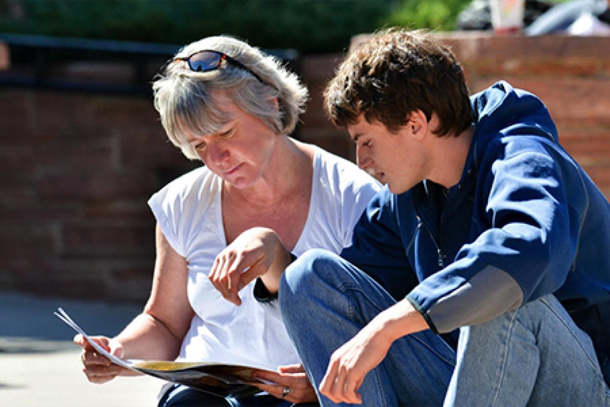 Mother and prospective business student reviewing financial aid
