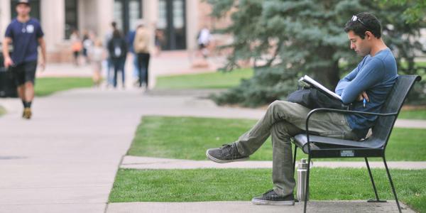 Student sitting on bench