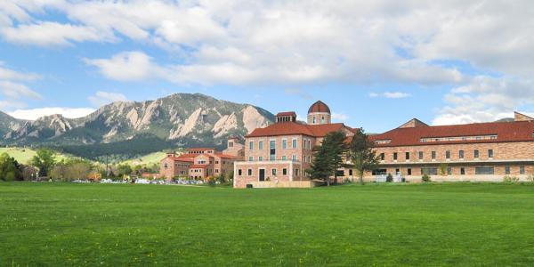 The Koelbel building with the Flatirons in the background