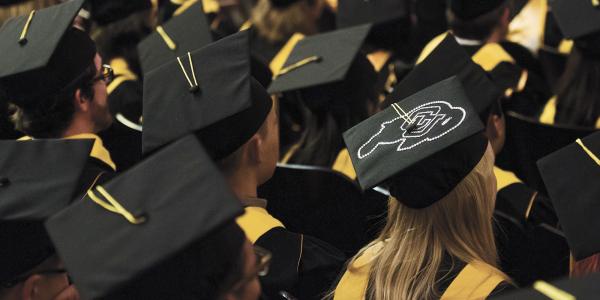 Photo of students sitting at graduation