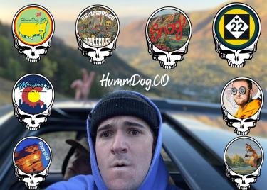 Andrew Hummel surrounded by Hummdog.CO sticker designs