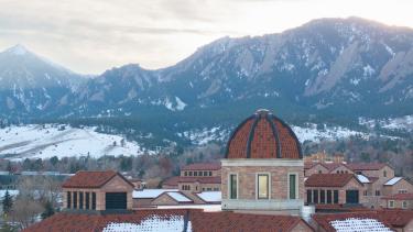 Aerial photo of CU Boulder's campus dusted with snow