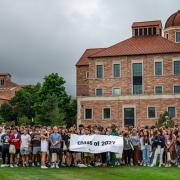 Images of Leeds School of Business Class of 2027 in front of the Koelbel Building