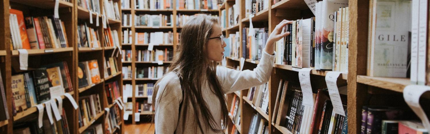 person looking at books