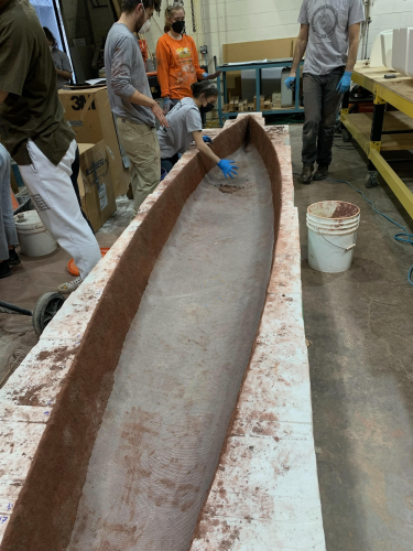 CU Boulder students making a concrete canoe