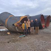 Four members of the team in front of ater transmission pipelines replaced due to fault rupture damage Gaziantep, Turkey