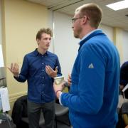 University of Colorado Boulder environmental design junior Josef Nelson, left, shares his ideas about the Sixth Avenue Plaza with Christ Church International Pastor Matthew Spencer on Wednesday.