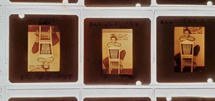 Three slides of a person sitting on a chair from Ann Roy's archive. 