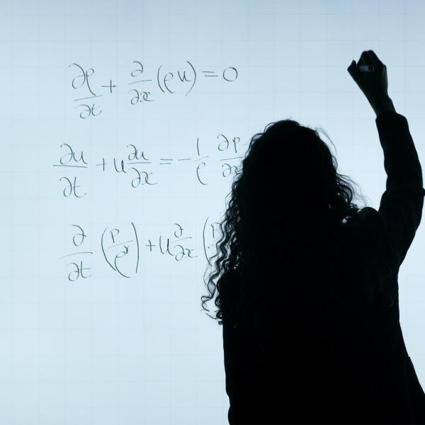 professor writing on a white board