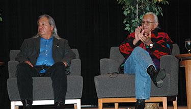 John Echohawk and Billy Frank Jr. sitting on stage