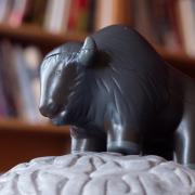 Buffalo toy in front of books