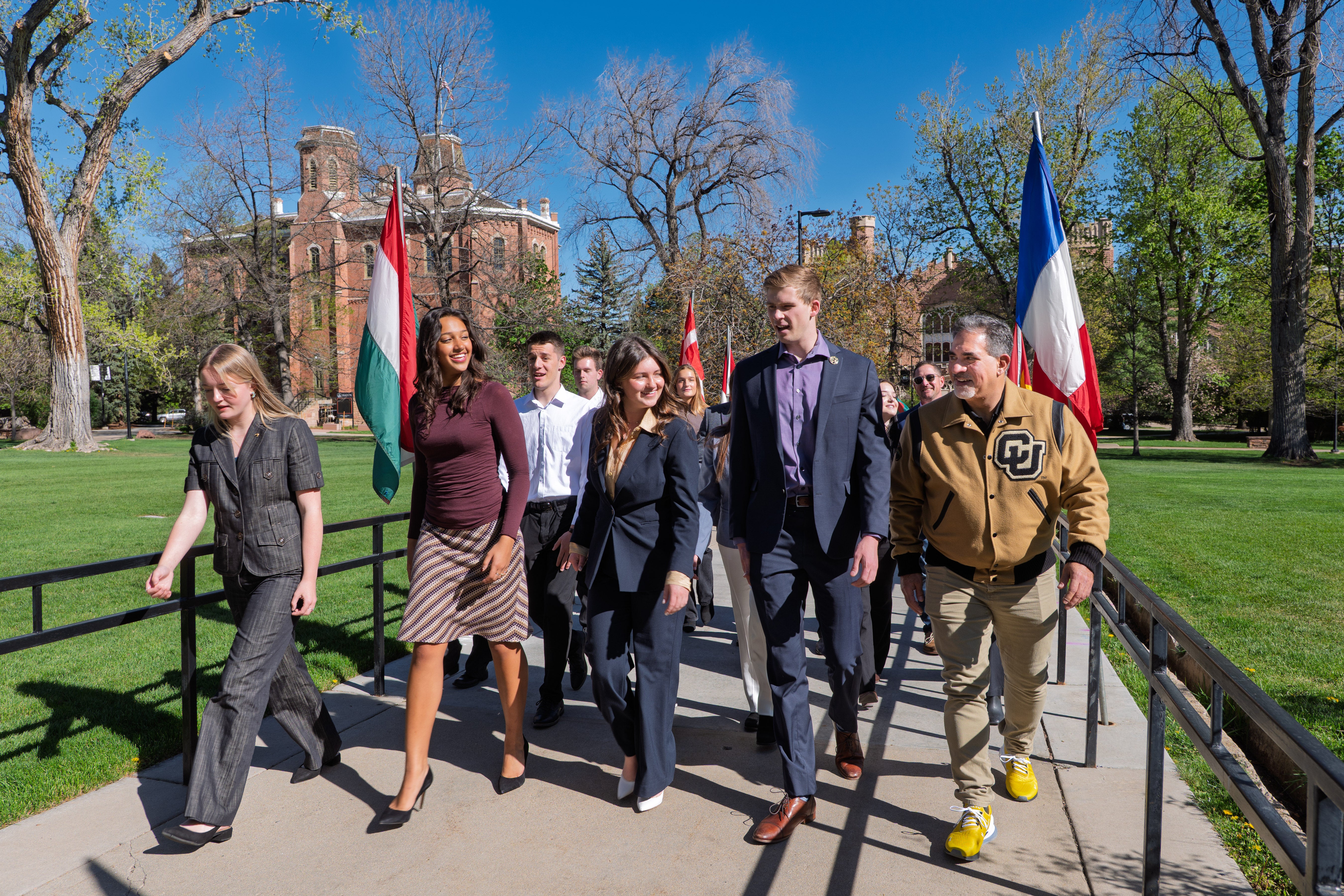 Chancellor Justin Schwartz processing with student leaders at the Conference on World Affairs