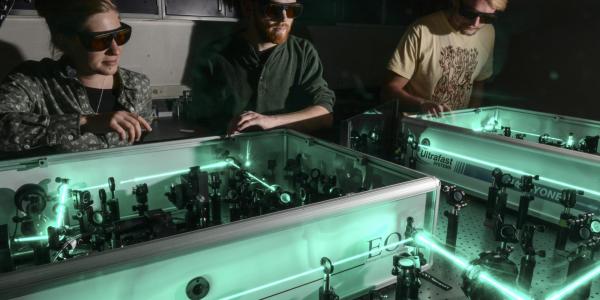 Graduate students in laser lab
