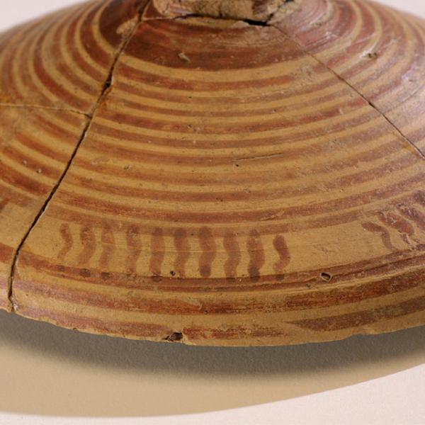 detail of banded patterning on lid