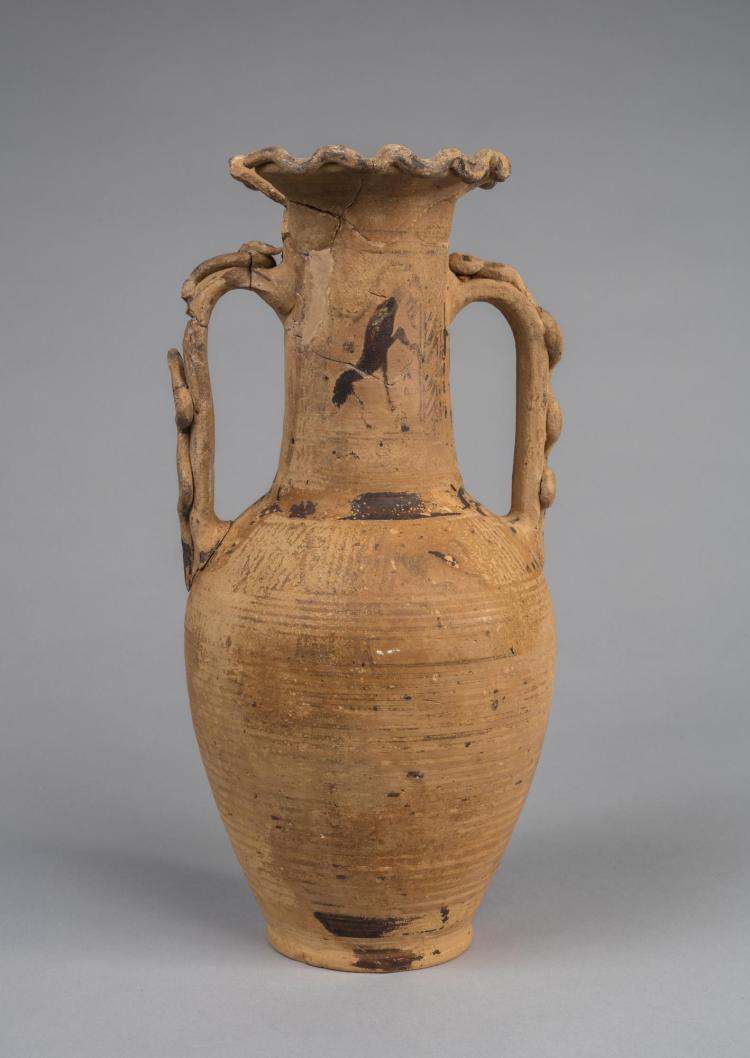 Photograph of yellowish-tan-colored amphora against neutral gray background.