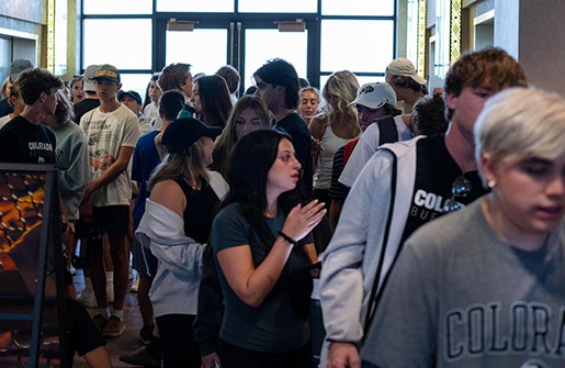 Students walk into the Byron White Club as orientation activities get underway.