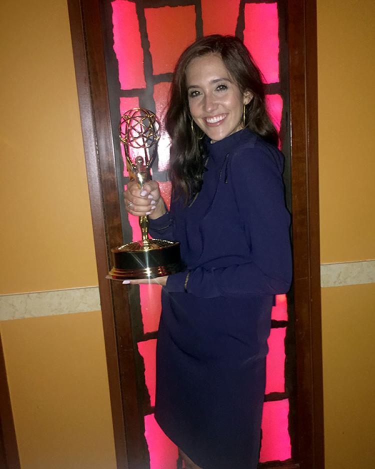 Savannah Sellers poses with her Emmy