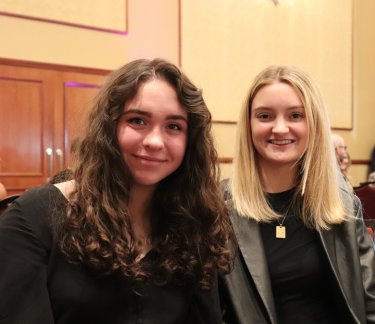 Students Casadee Subart (left) and Hailey Caress at the Nov. 11 ceremony. They submitted individual projects to the Denver One Show, and each earned a merit award.