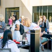 Students around a table at the involvement fair.