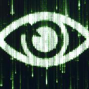 A Matrix-style eye on a screen.