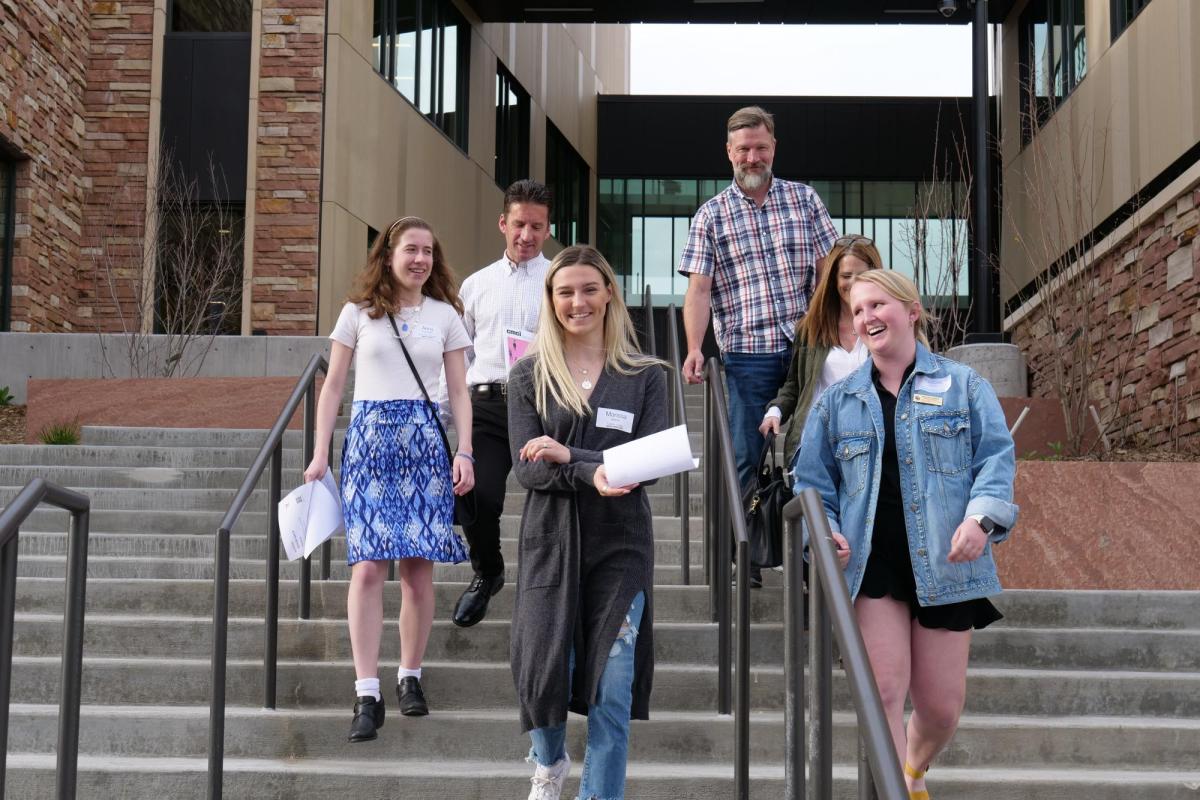 Students walking down some stairs at the CU Boulder campus