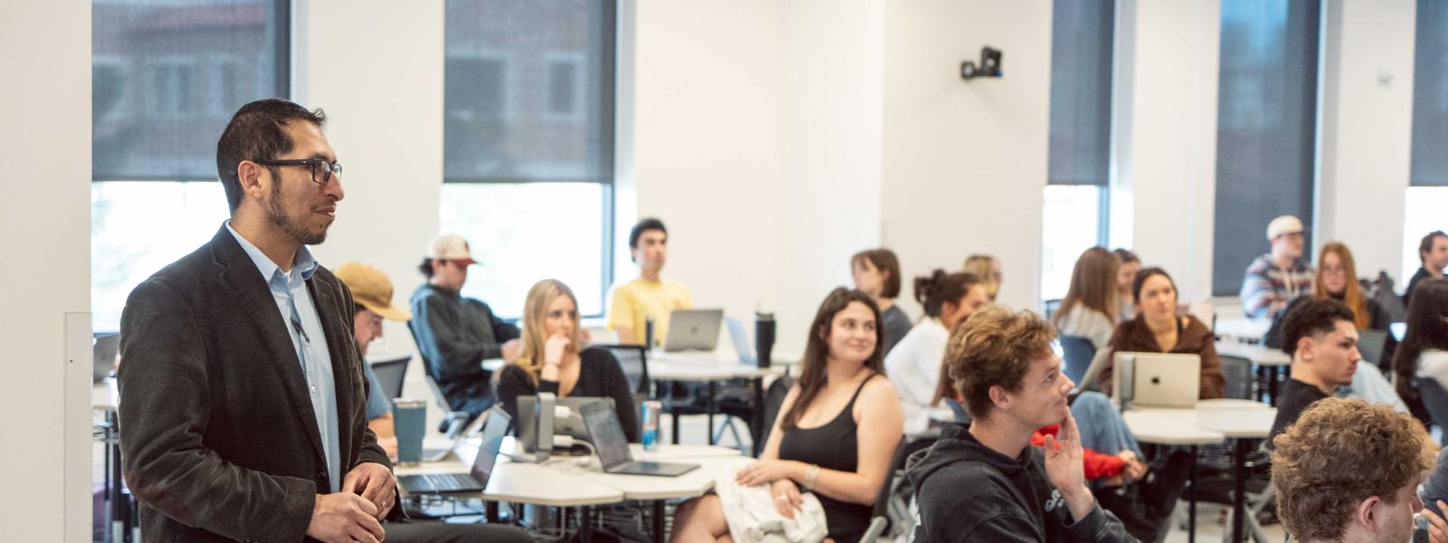 Joe Izaguirre Lecturing COMM students