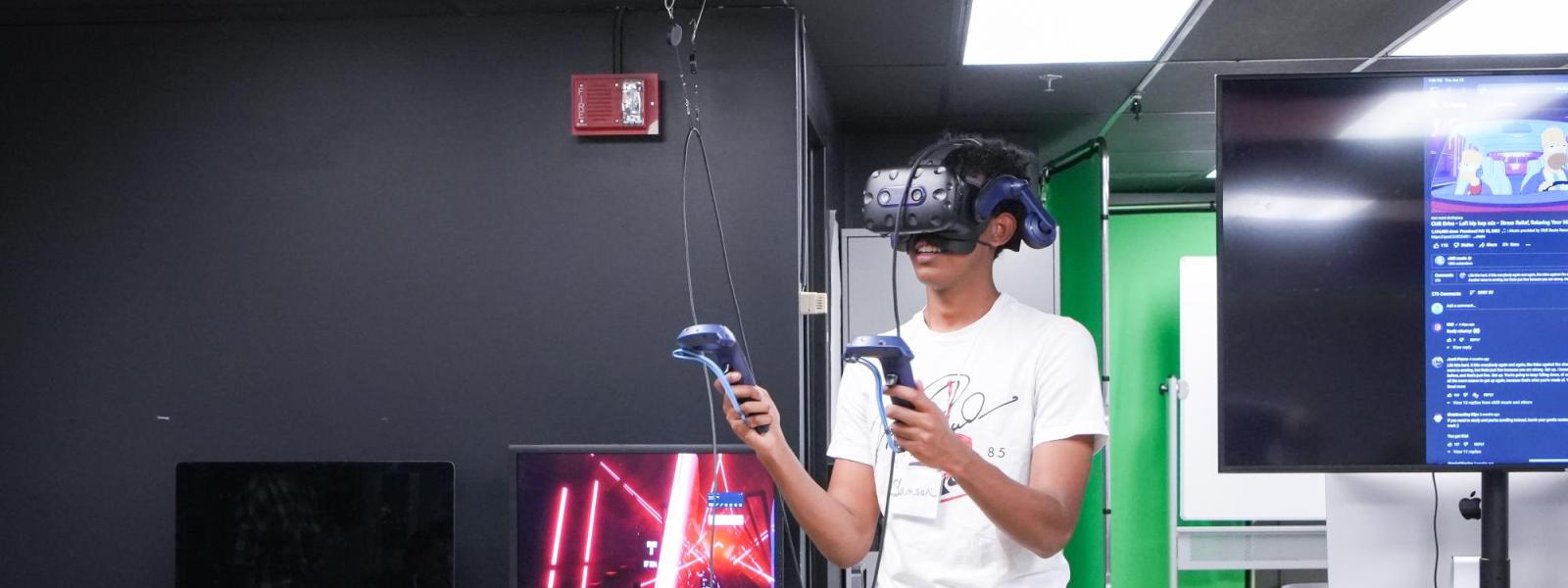 Student using VR headset in the Immersive Media Lab