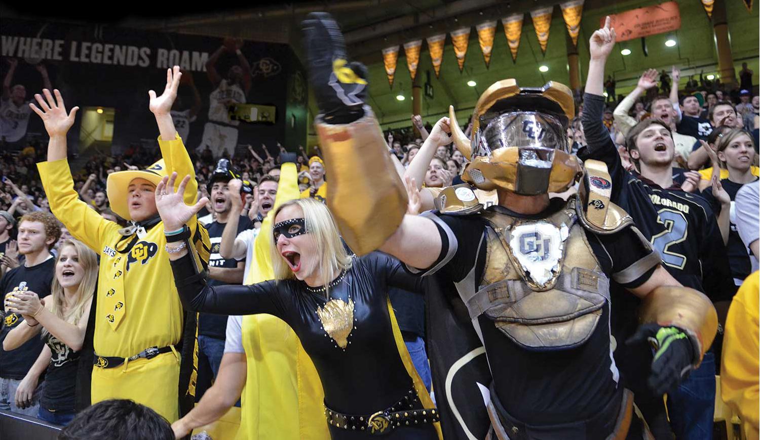 ick Shearon, known as “Buff Man,” and “Buff Girl” Courtney Benejam cheer on the Buffs