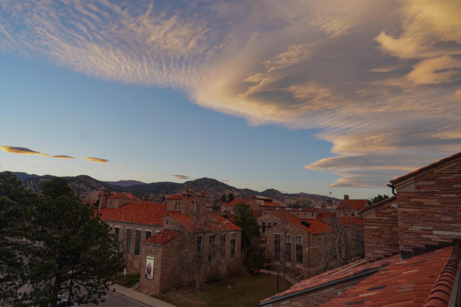 Cloudy skies over CU Boulder's classic Italianate architecture. 