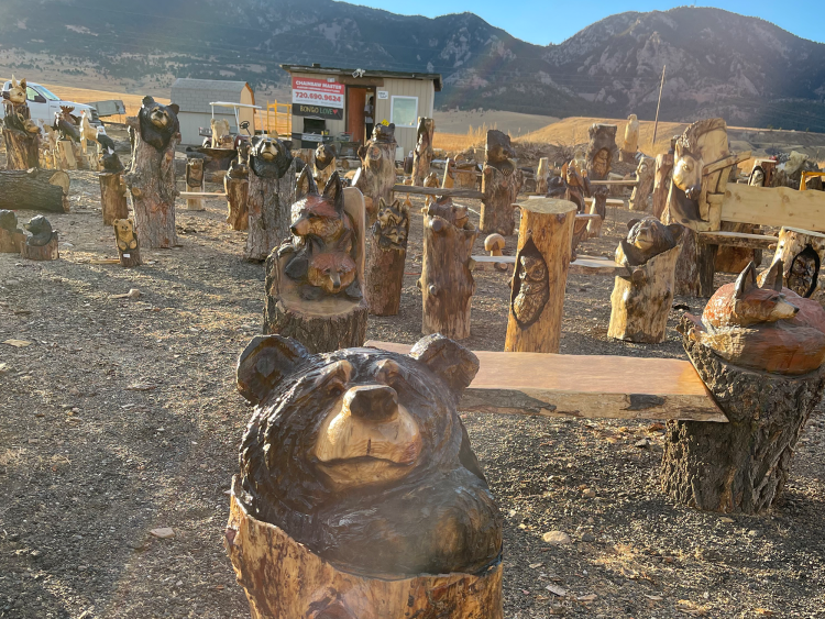 Bongo Love's wood carvings outside of the Rocky Flats Bar & Grill.