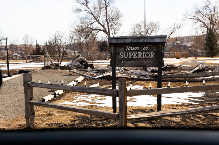 Town of Superior sign surrounded by environment impacted by the Marshall Fire