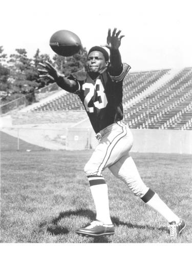 Cliff Branch playing football. 