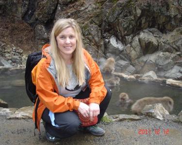 researcher Sara Sawyer next to snow monkeys