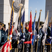 color guard holding military flags 