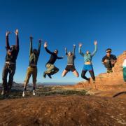 Members of the CU Hiking Club jump for joy