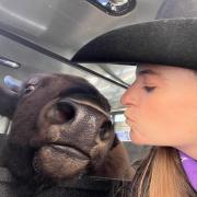 Selfie with Ralphie the buffalo and her handler