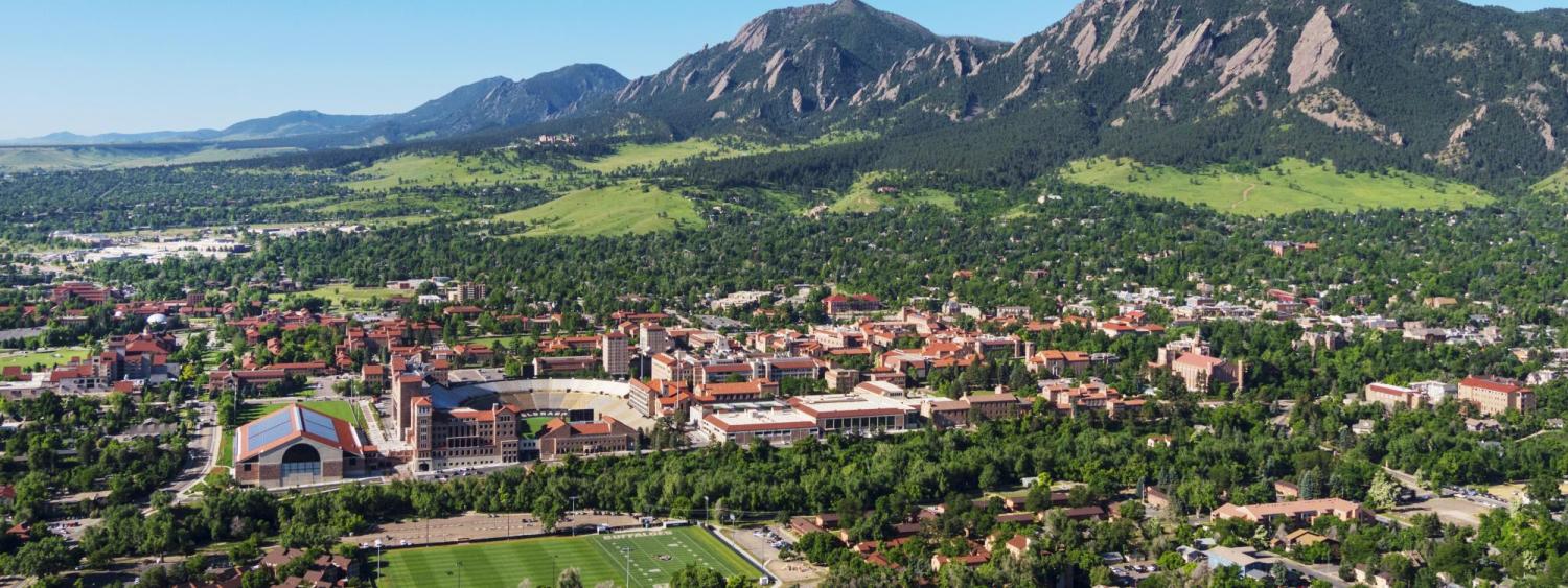 Aerial photo of the Boulder area including campus and the Flatirons Mountains