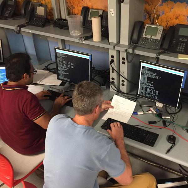 Network Engineering students working in the network engineering lab with Linux and VoIP