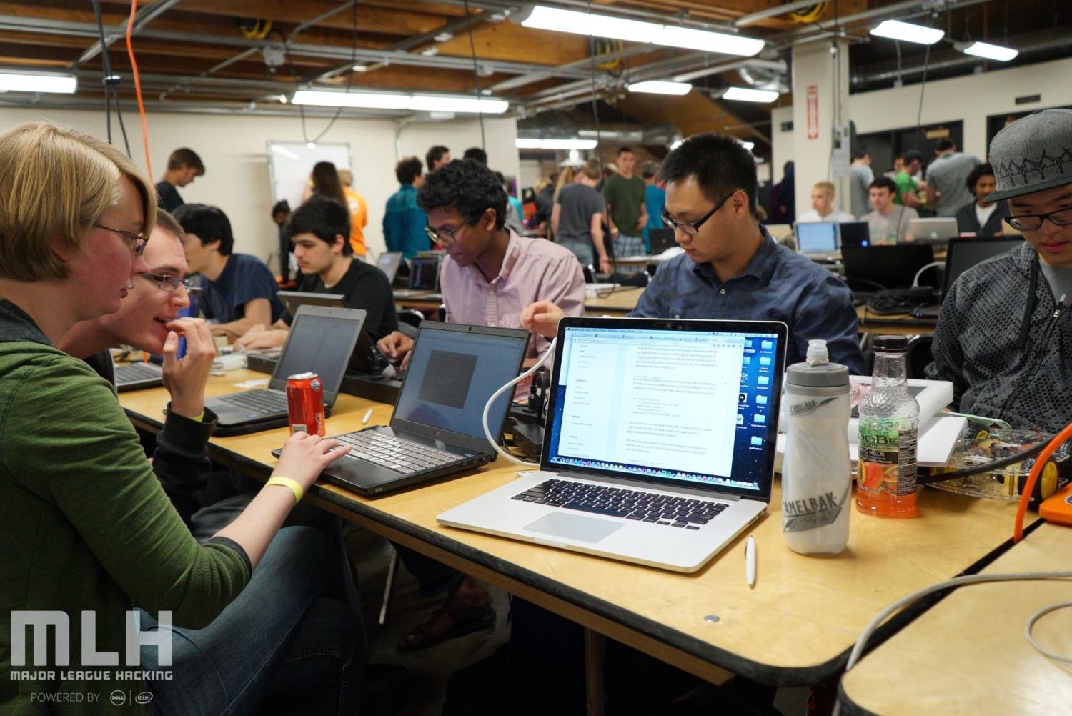 Students work on their laptops in the Idea Forge during Hack CU 2015. 