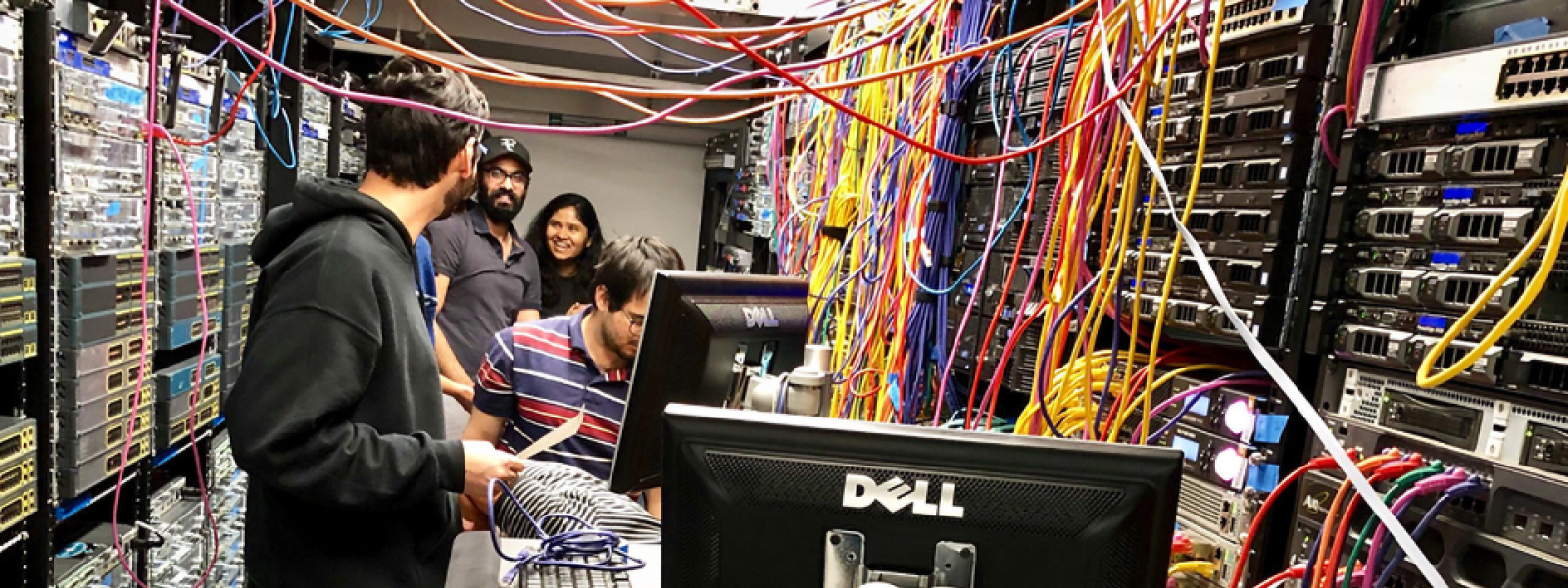 Network Engineering students working in the network engineering lab with network cabling