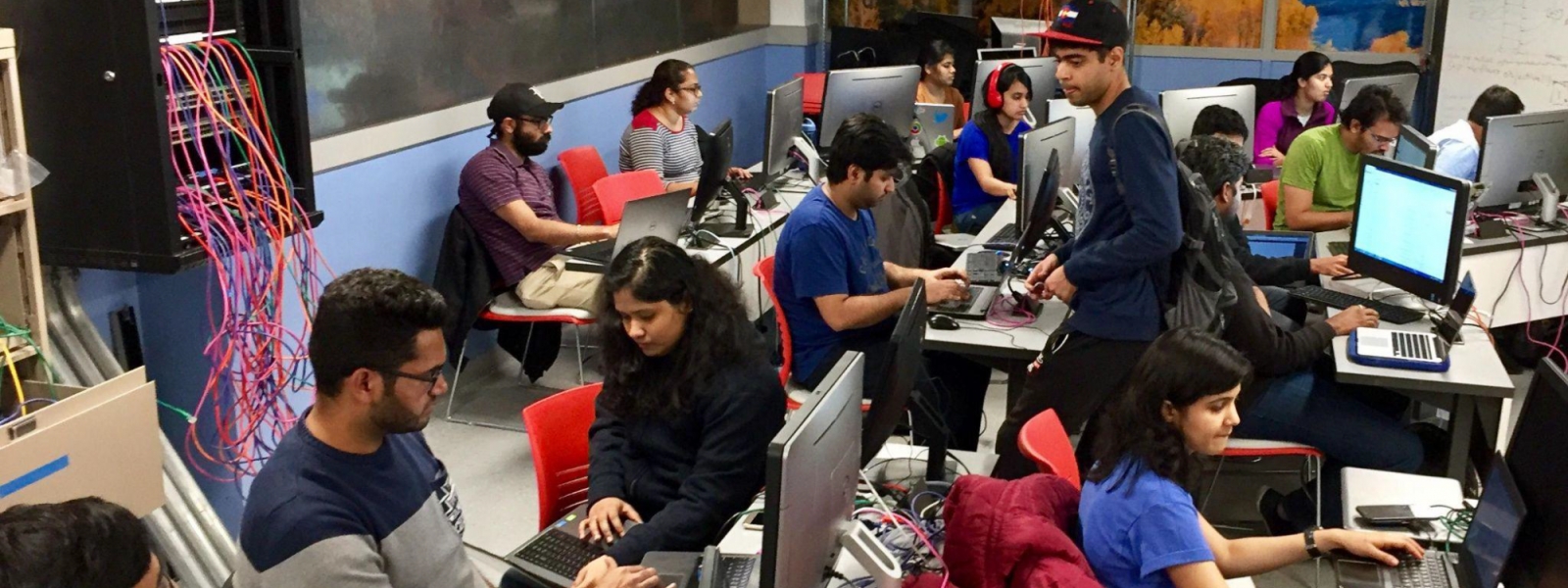 Network Engineering students at workstations in data center access room