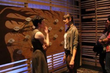 A cast member interacts with an audience member during a Quantified Self performance
