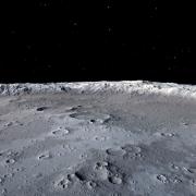 The surface of the moon, with empty space in the background