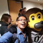 A selfie of Gupta with Chip the buffalo mascot. 