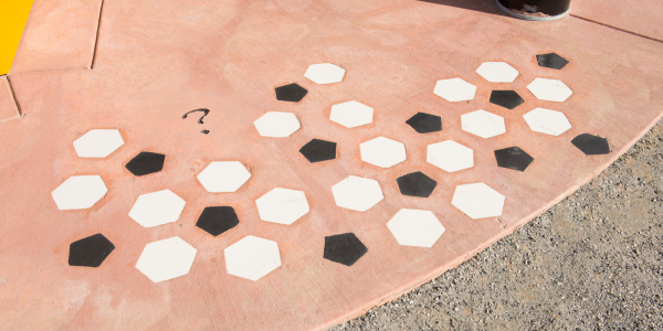 White hexagons and black pentagons embedded in concrete