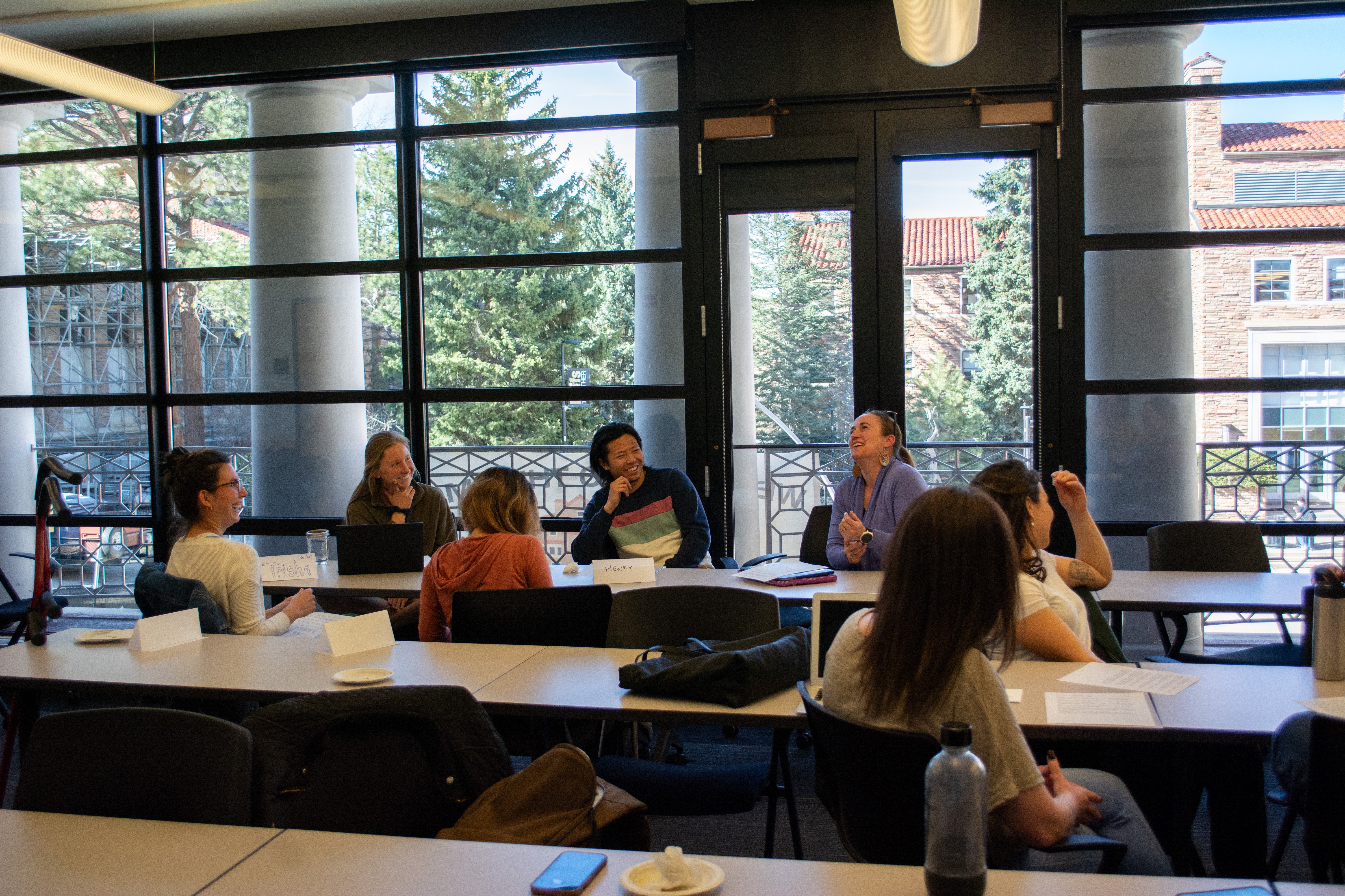 students at table laughing