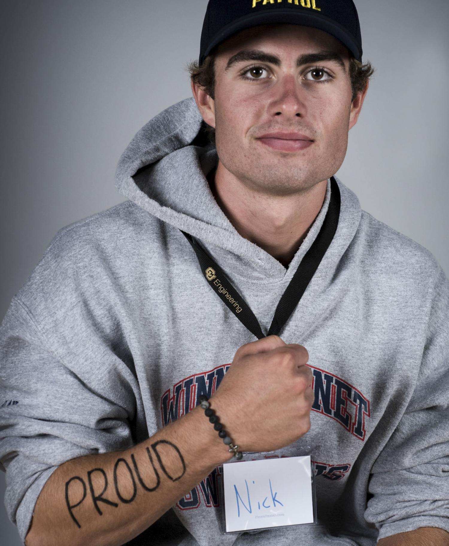 Male student with writing on arm